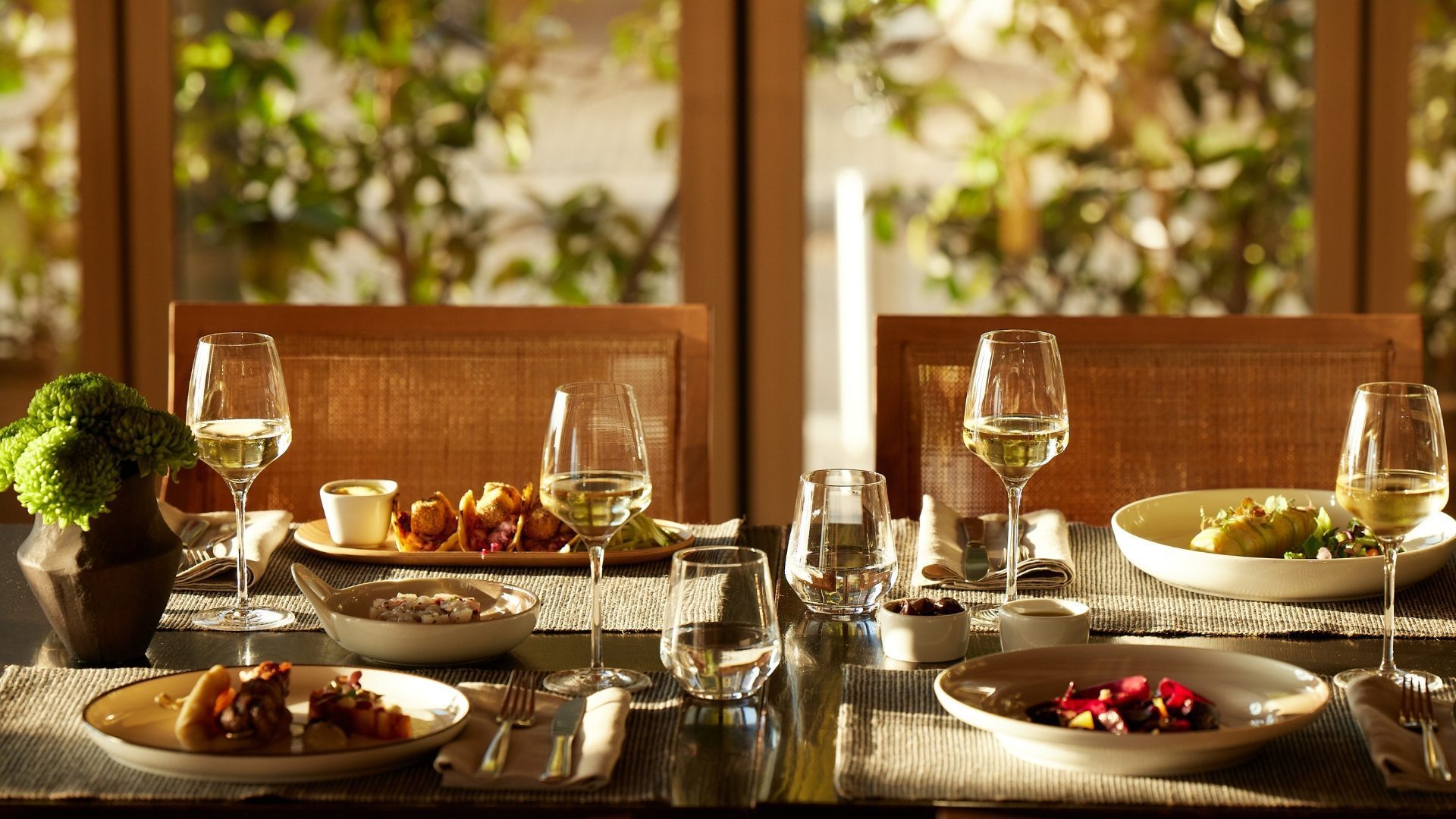 dining table with plates and delicious food at Daios Bar Restaurant